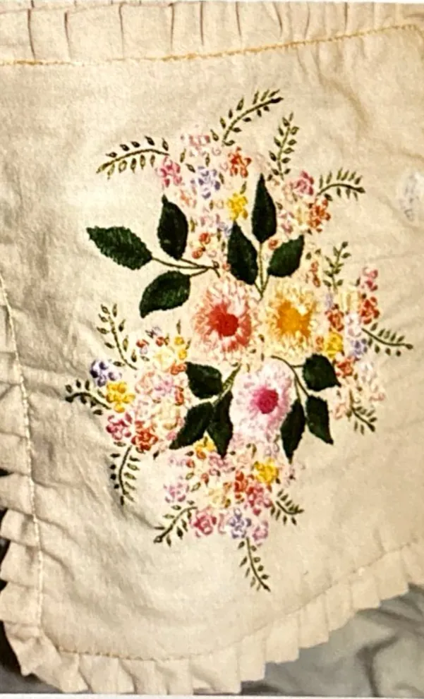 Hand embroidered flowers on linen